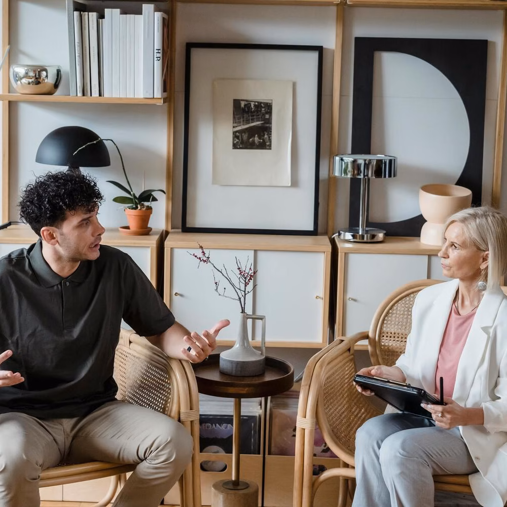 Client talking with a therapist in a counselling room