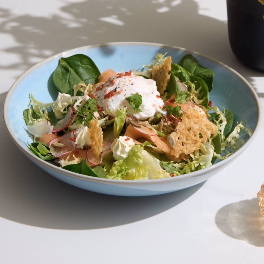 Chef-prepared salad with a poached egg