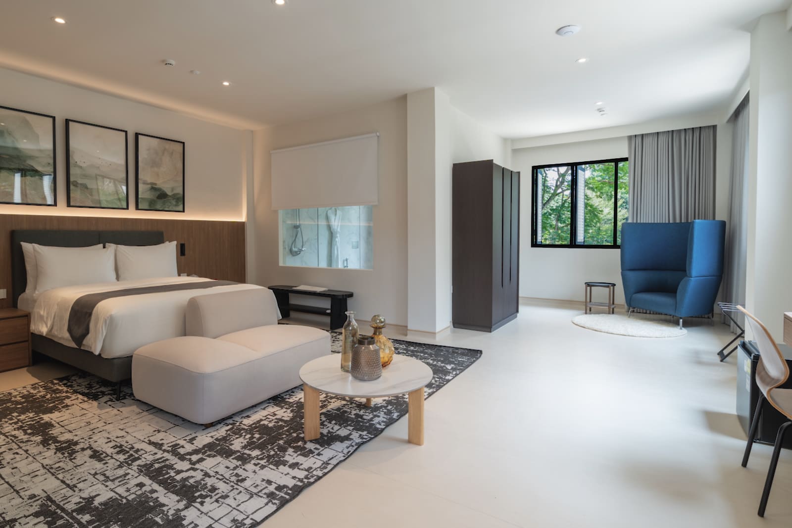 Sanctuary Corner suite with king bed, sofa and armchair