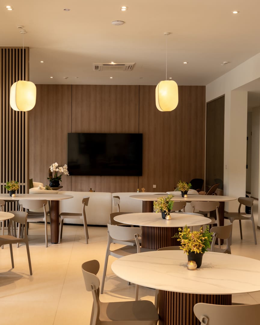 Communal dining room with round tables